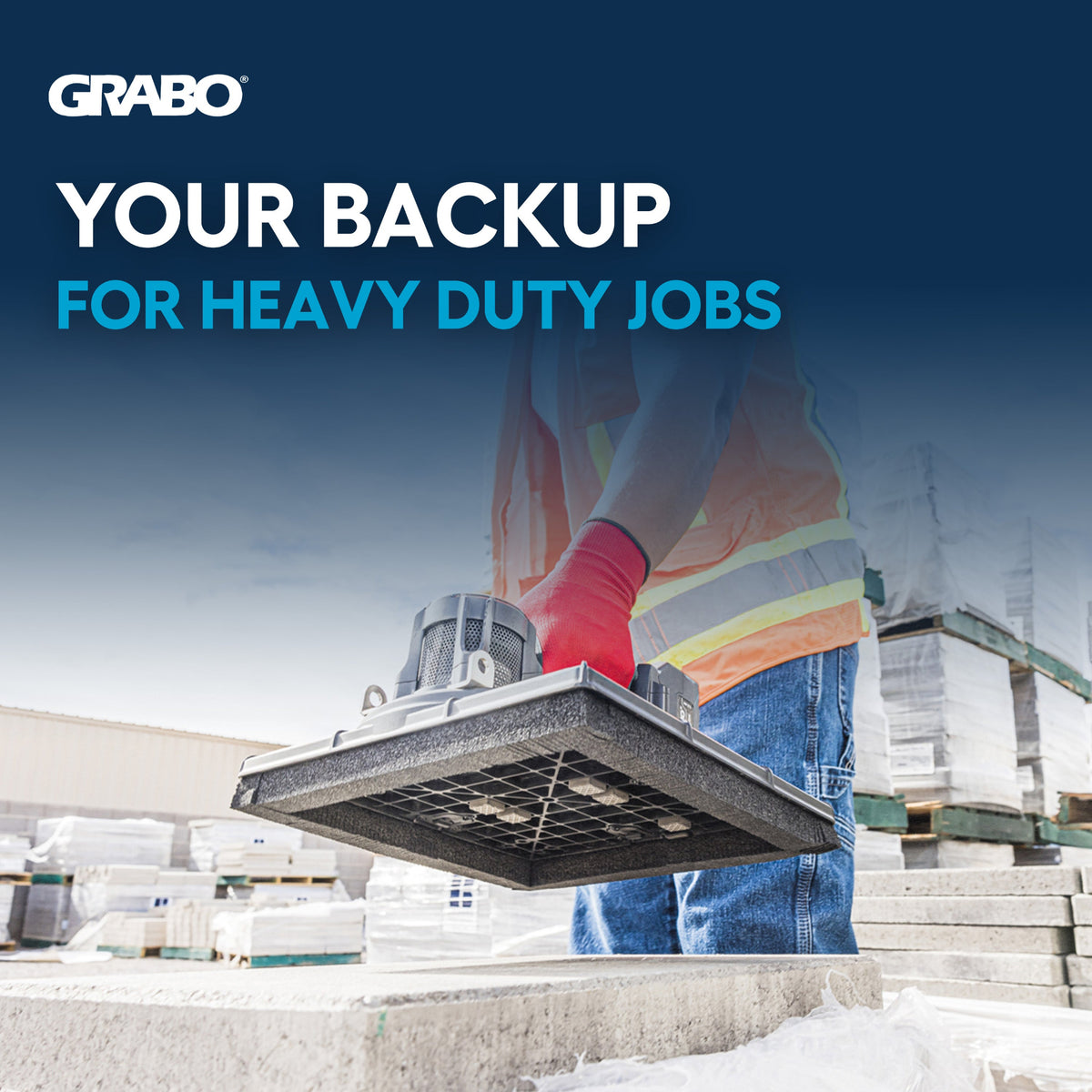 Grabo heavy-duty backup pallet jack advertisement with a worker in a high-visibility vest and red glove holding the pallet jack over concrete blocks, with the text 'YOUR BACKUP FOR HEAVY DUTY JOBS' and the Grabo logo.