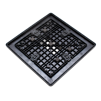 A square black plastic drainage grid or filter mat with a raised border and perforated center, shown on a plain white background.