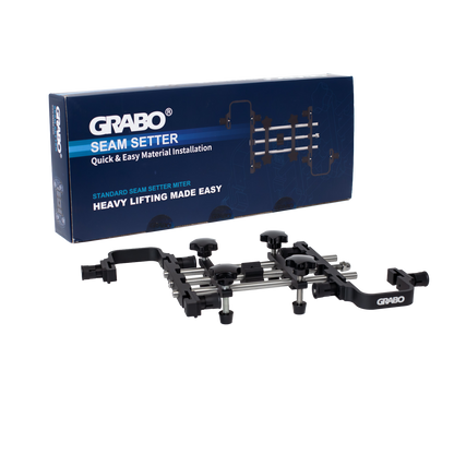 A GRABO Seam Setter tool and its retail box, displayed on a clean white background. The product is a black and silver metal mounting frame with adjustment knobs, shown in front of its blue packaging box.