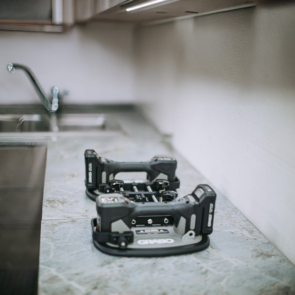 Power tool set on a kitchen counter with a blurred background